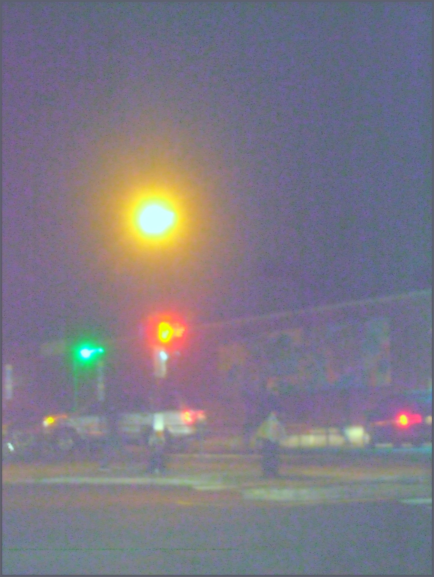 Guy on a Corner With a Big Light in the Background feb 18