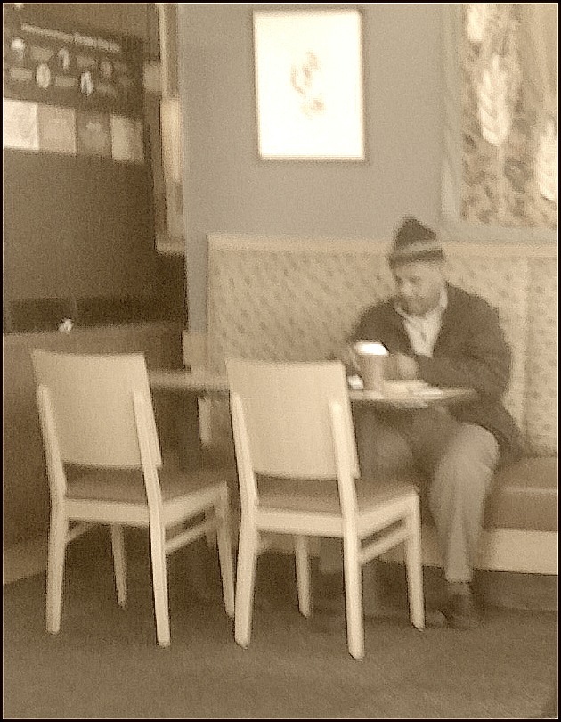 One Man Sitting in the Cafe With a Coffee Cup feb 22