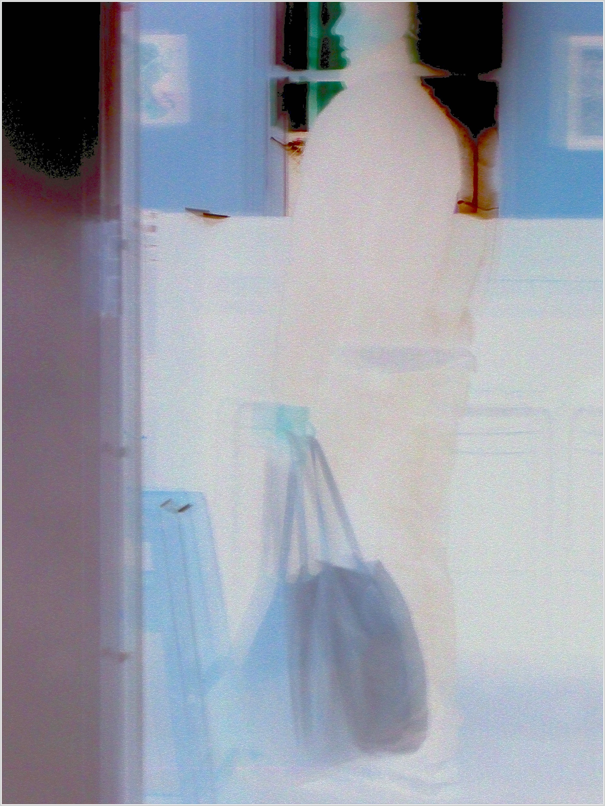 Guy With a Bag Before a Window in a Cafe march 19 2012