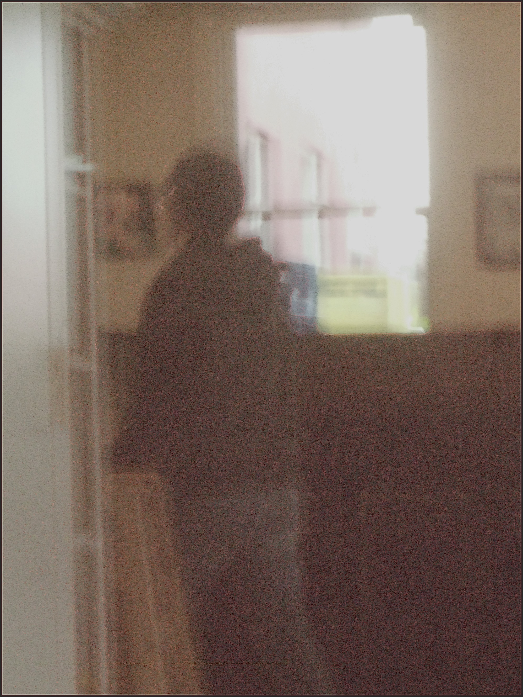 Guy Walking Before a Window in Northside Social Cafe march 15